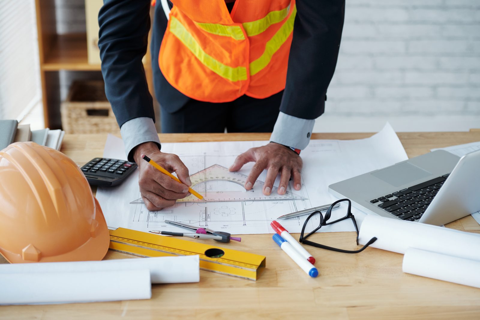 Engineer working on building plans